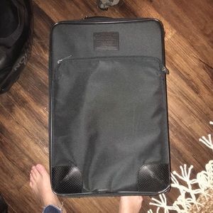 Coach carry on suit case with leather trim